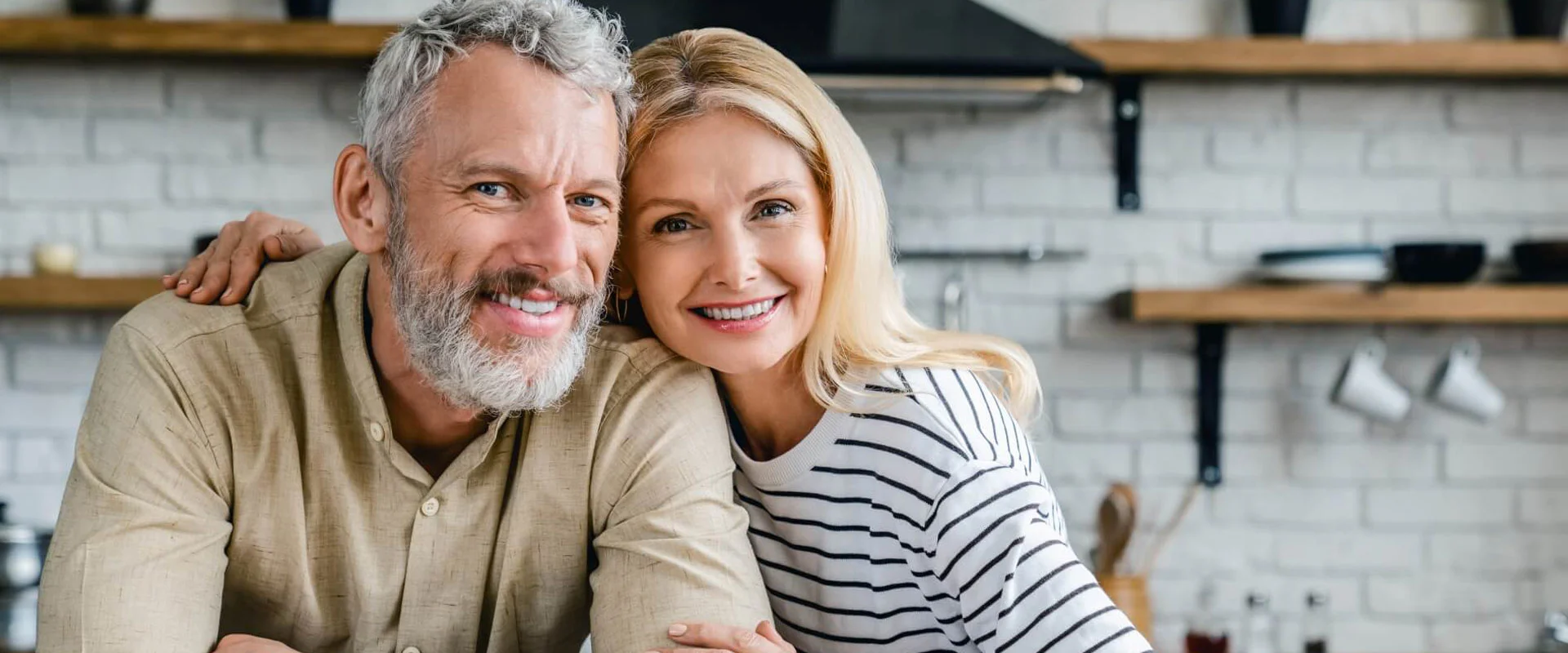 Smiling older couple in a kitchen